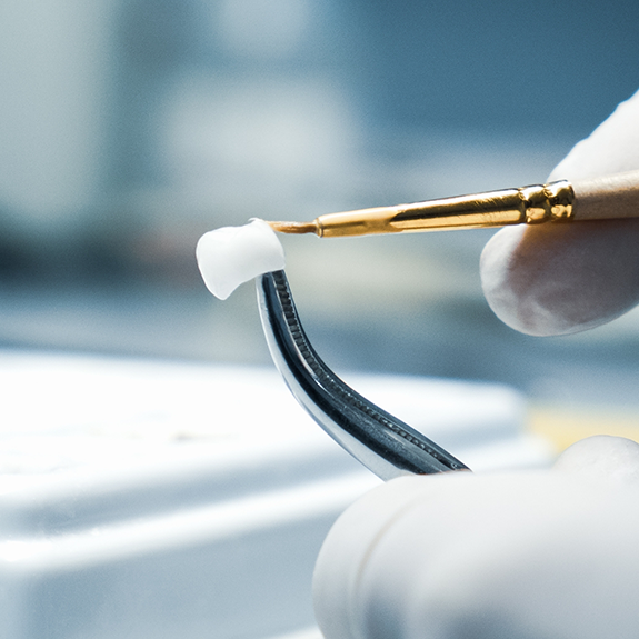 Close up of gloved hands working on a dental crown in Reynoldsburg