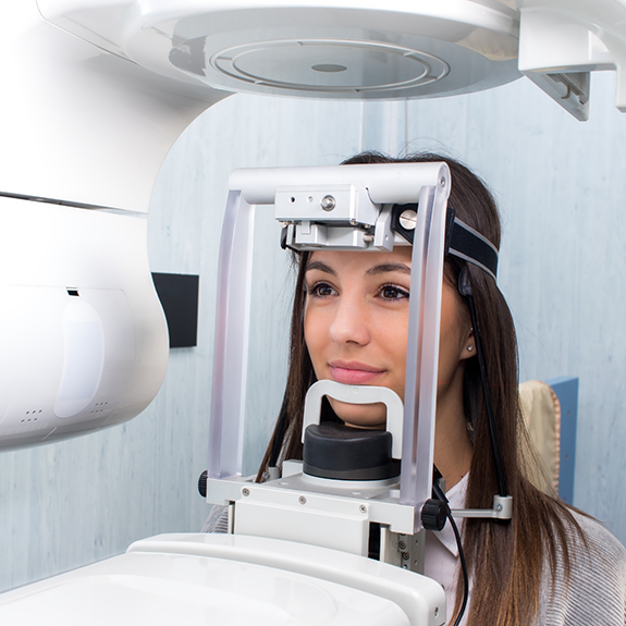 Female patient and cone beam scanner