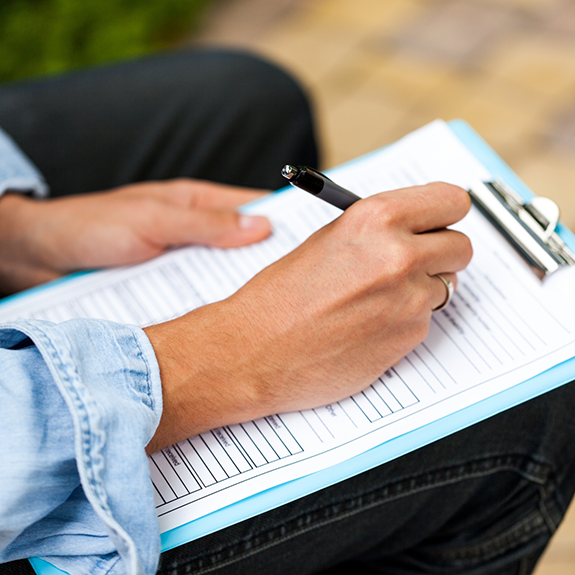 Dental patient filling out a form