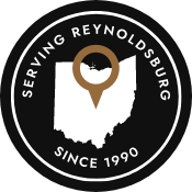 Badge reading Serving Reynoldsburg Since 1990