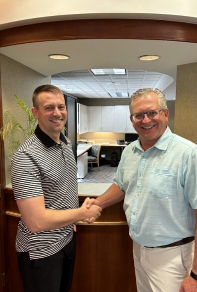 Dr Mick and Dr Glynn shaking hands