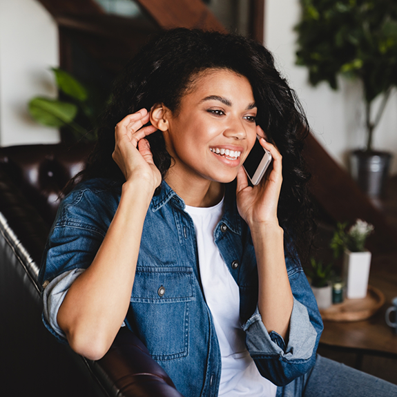 Woman smiling and talking on phone