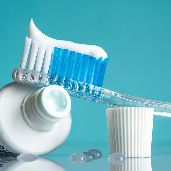 Toothbrush on top of toothpaste tube