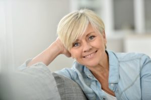 older woman smiling showing nice teeth