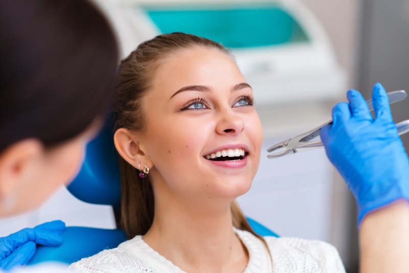 Woman about to have a tooth extracted