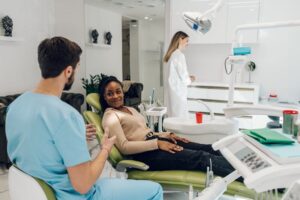 Dentist and patient discussing dental implant treatment plan